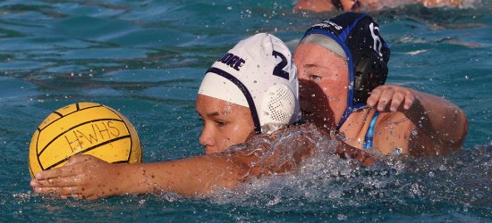 Hailee Guerra protects the ball in a recent match against Hanford West.